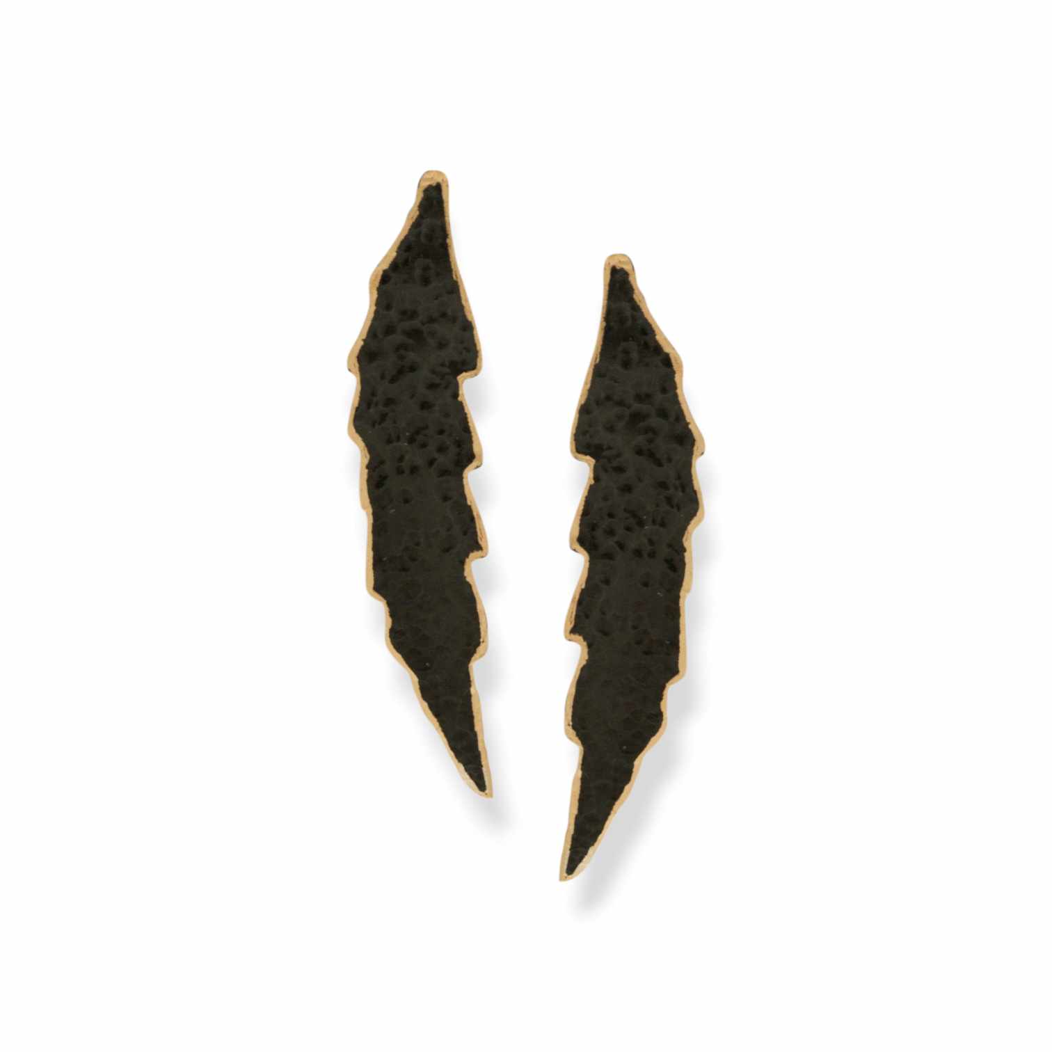 Handmade brass earrings in an elongated, abstract leaf shape, featuring black oxidized texture and gold-toned edges. The ear post is made of 925 sterling silver. Available in gold-plated, black oxidized, or free nickel finish.