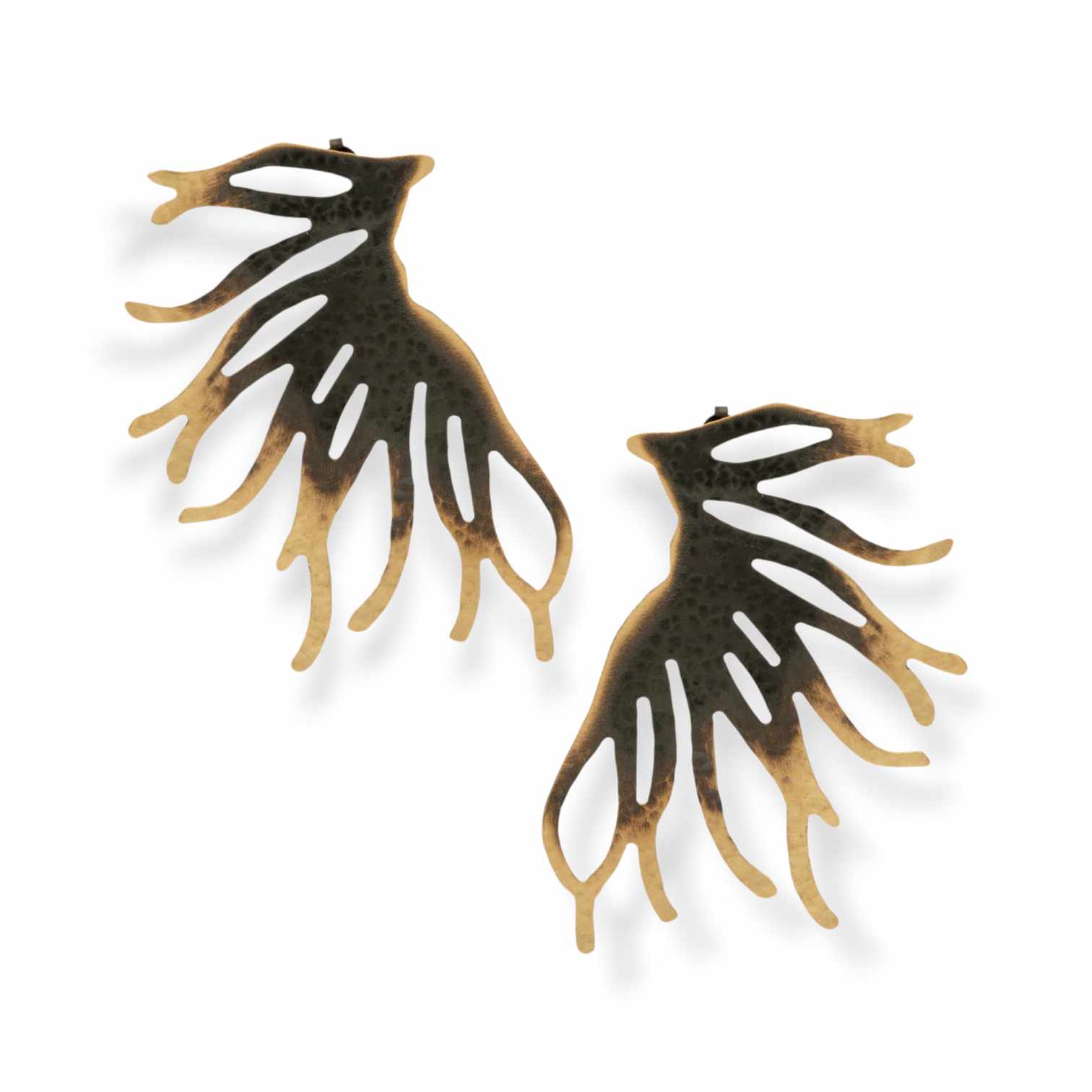 Handmade brass earrings in an abstract, organic shape with a striking two-tone design – combining black oxidized and gold-plated finish. Bold style that frames the ear. The ear post is made of 925 sterling silver. Available in gold-plated, black oxidized, or free nickel finish.