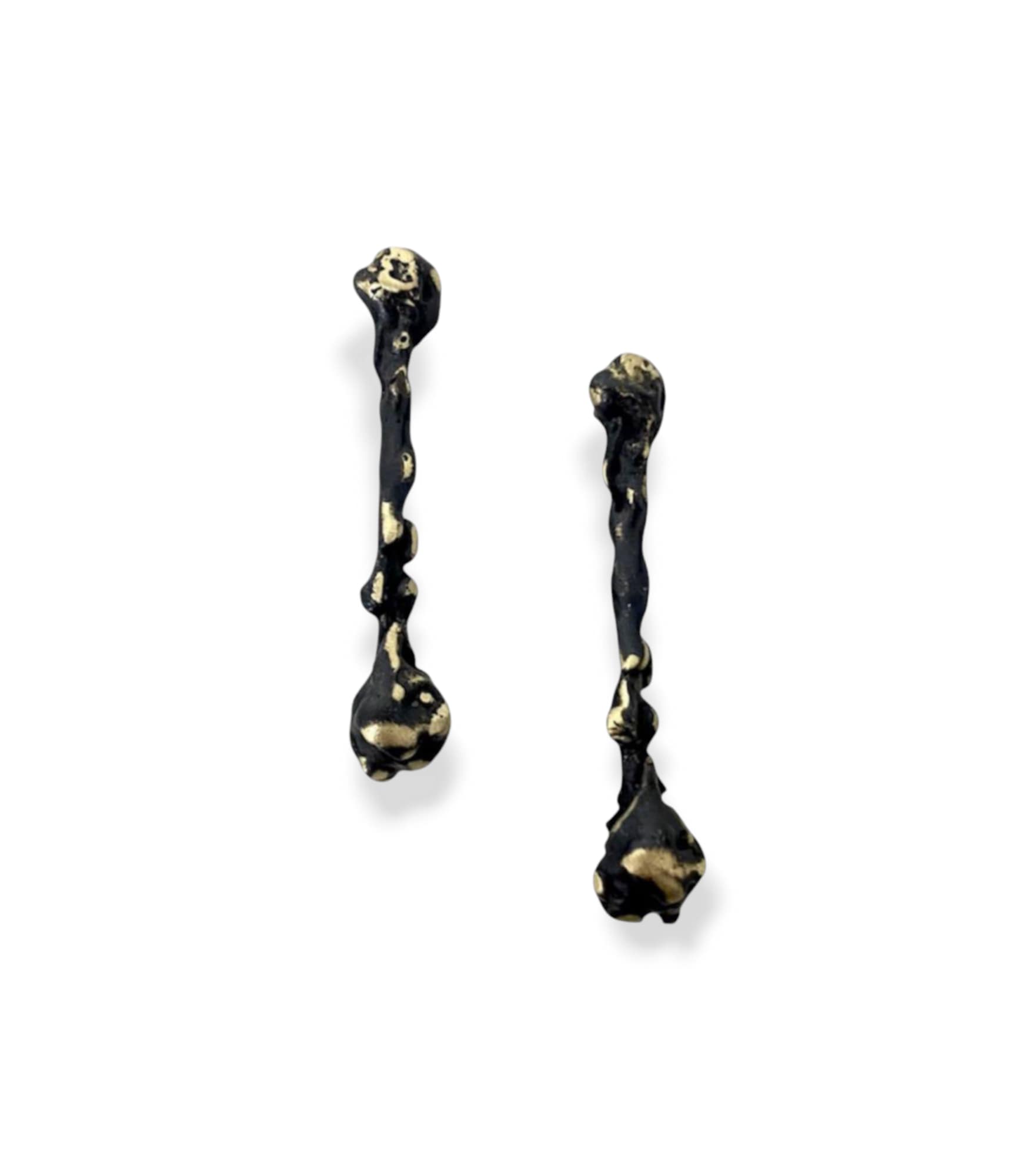 Handmade brass earrings featuring an organic, textured form in a black oxidized finish with subtle gold-toned details. The ear post is made of 925 sterling silver. Available in black oxidized, gold-plated, or free nickel finish.