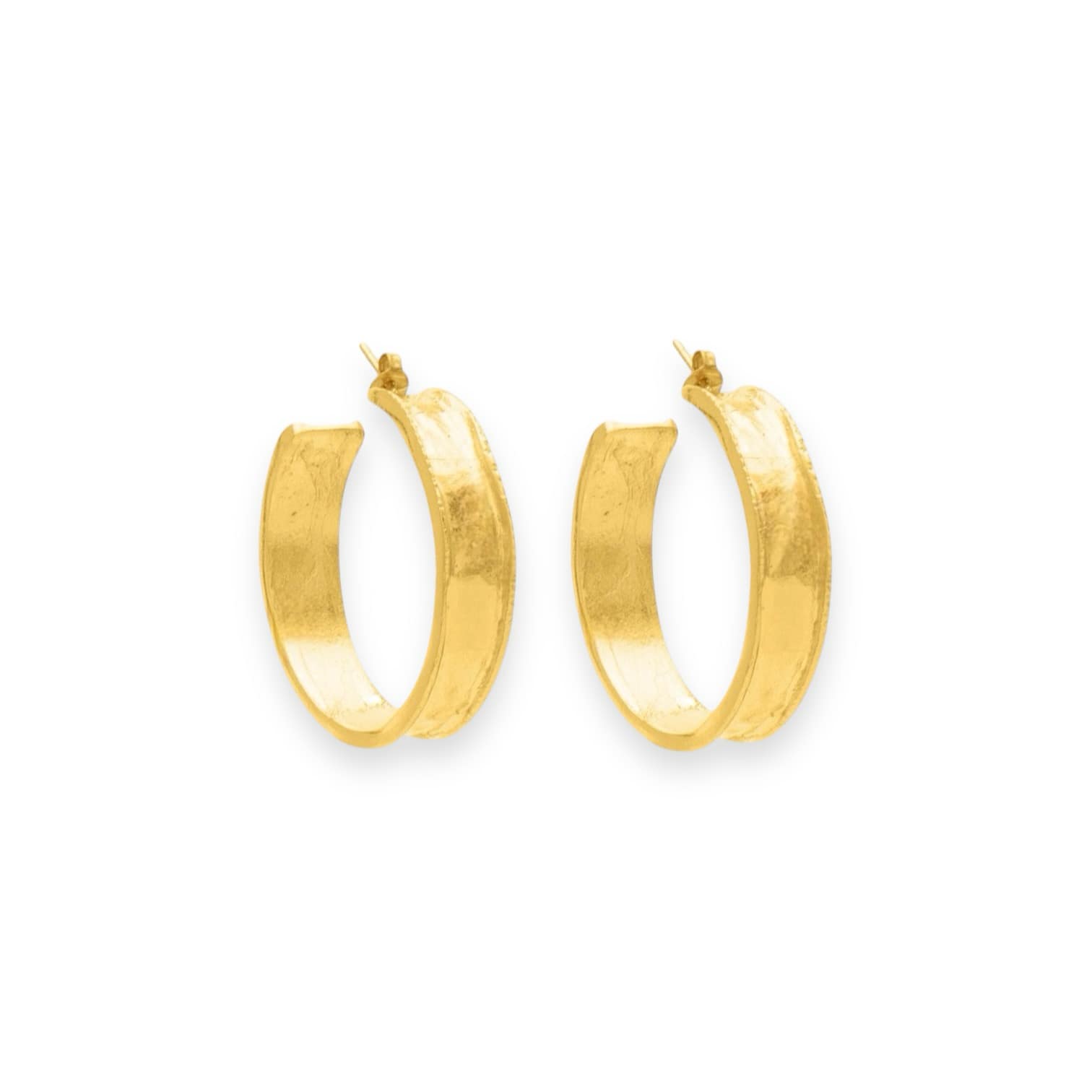 Handmade brass hoop earrings with smooth surfaces and a sleek, minimal design. Available in a gold-plated finish, with a 925 sterling silver ear post. Also available in free nickel or black oxidized finish.